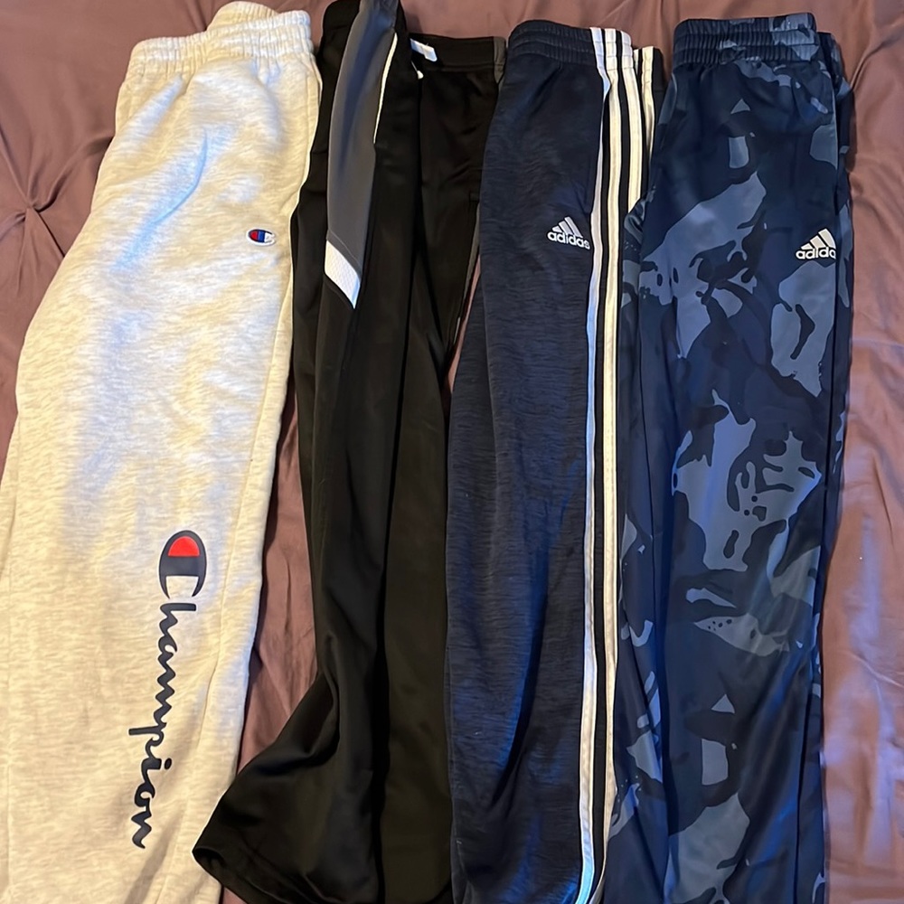 Four pairs of boys size medium medium pants